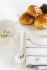 Glazed profiteroles on stand — Stock Photo