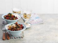 Quorn chilli in blue bowls over table — Stock Photo