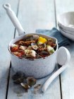 Closeup view of fish and mussel stew in pot — Stock Photo