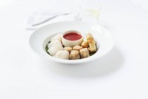 Elevated view of various types of Dim Sum on a plate with a dip — Stock Photo