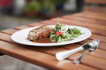 Beef roulade with mustard and salad — Stock Photo