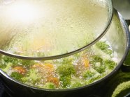 Broccoli soup in saucepan — Stock Photo