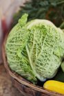 Savoy cabbage in vegetable basket — Stock Photo