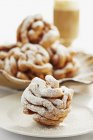 Closeup view of fried dough sweets with powdered sugar — Stock Photo