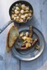 Lamb sausages with onions — Stock Photo