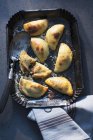 Top view of stuffed potato pastries with server on tray — Stock Photo