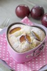 Cake in heart-shaped baking tin — Stock Photo