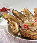 Grilled potato halves with dip — Stock Photo