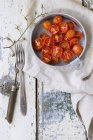 Bowl of baked cherry tomatoes — Stock Photo