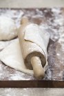 Rolled out pizza dough — Stock Photo