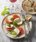 Tomatoes mozzarella and basil — Stock Photo