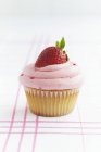 Cupcake topped with strawberry — Stock Photo