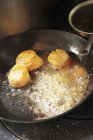 Closeup view of frying scallops with oil in pan — Stock Photo