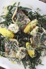 Sea bass with scallops and samphire — Stock Photo