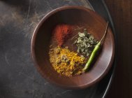 Indian spices and green chilli in a wood bowl on tray — Stock Photo