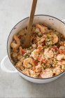 Closeup view of shrimp Perloo in pan with wooden spoon — Stock Photo