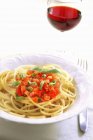 Spaghetti with diced tomatoes — Stock Photo