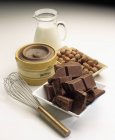 Chocolate, milk and nuts — Stock Photo