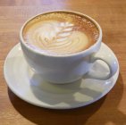 Чашка кави з намальованою — стокове фото