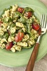 Fusilli pasta salad with basil pesto — Stock Photo