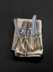 Top view of antique cutlery on a fabric napkin — Stock Photo
