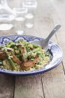 Couscous with chicken breast strips — Stock Photo