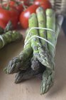 Green asparagus and tomatoes — Stock Photo