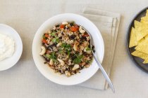 Gallo Pinto (Mexican bean dish) vegetarian and gluten-free on white plate with spoon — Stock Photo