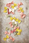 Various coloured farfalle pasta — Stock Photo