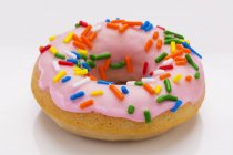 Doughnut with colorful sprinkles — Stock Photo