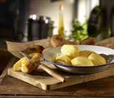 Peeled Potatoes in bowl — Stock Photo