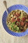 Fava bean stew with chorizo and coriander — Stock Photo