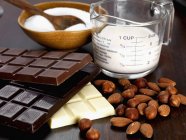 Almonds, hazelnuts, chocolate — Stock Photo
