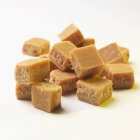 Closeup view of butter fudge heap on white surface — Stock Photo