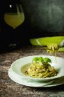Spaghetti pasta with pesto and chicken — Stock Photo