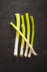 Five raw spring onions — Stock Photo