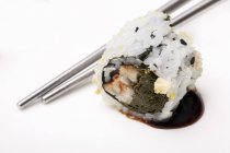 Uramaki sushi with soy sauce — Stock Photo