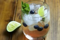 Mojito with blueberries and ice cubes — Stock Photo