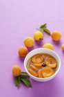 Apricot compote with cloves — Stock Photo