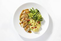 Chicken breast with tagliatelle pasta — Stock Photo