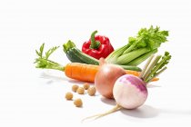 Arrangement of vegetables on white background — Stock Photo