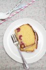 Corn cake with raspberries on plate — Stock Photo