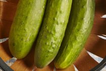 Fresh cucumber in wooden basket — Stock Photo