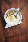 Yoghurt and honey in bowl — Stock Photo