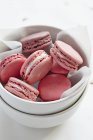 Pink macaroons in bowl — Stock Photo