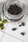 Fresh mulberries in preserving jar — Stock Photo
