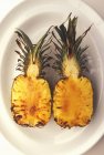 Roasted pineapple halves — Stock Photo
