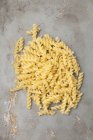 Dry uncooked pile of fusilli pasta — Stock Photo