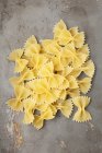 Dry uncooked pile of farfalle pasta — Stock Photo