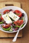 Classic Greek salad in bowl — Stock Photo